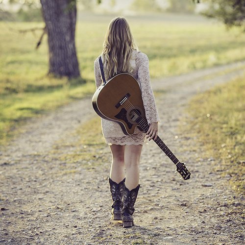 woman-in-white-long-sleeve-dress-carrying-a-guitar-164767.jpg